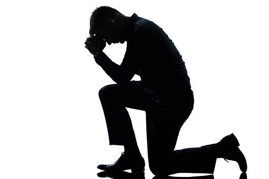 silhouette man kneeling sadness praying full length