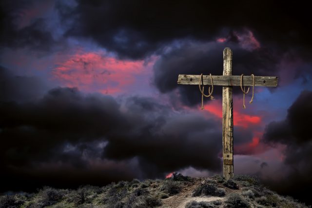 Empty Cross Against an Angry Sky